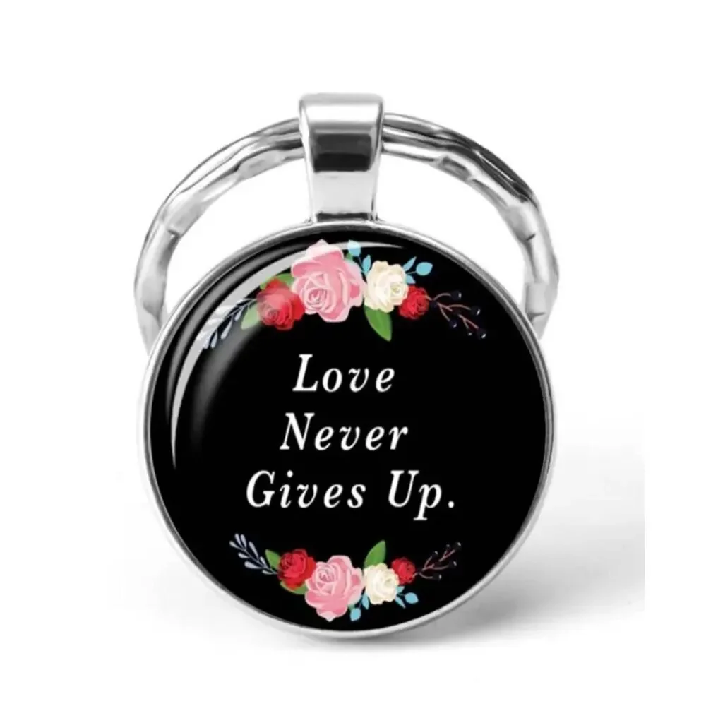 Ladies Black Round Love Never Gives Up Keychain